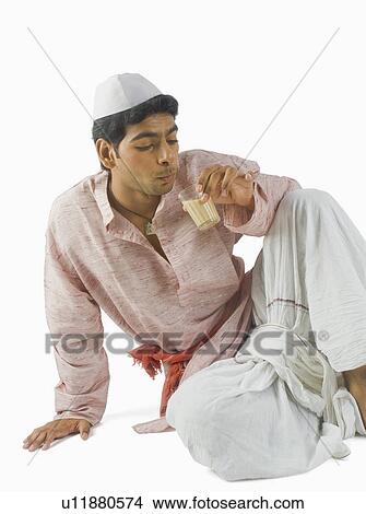 Man drinking tea View Large Photo Image Picture - Man drinking tea. Fotosearch