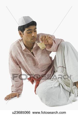 Stock Photograph - Man drinking tea. Fotosearch