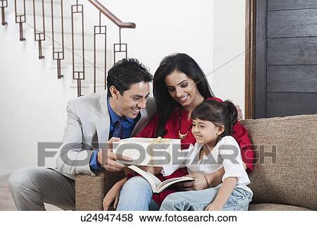 Man giving gift to his daughter View Large Photo Image Stock Photo - Man giving gift to his daughter. Fotosearch