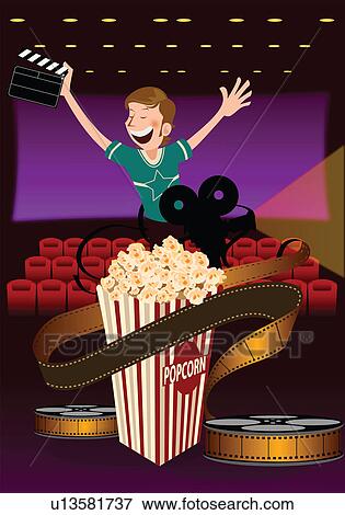 Stock Photo - Man holding a film slate in a movie theater with popcorn. Fotosearch