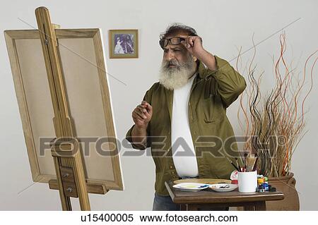Stock Photography - Man painting. Fotosearch