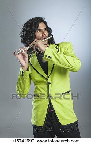 Man playing a flute View Large Photo Image Stock Image - Man playing a flute. Fotosearch