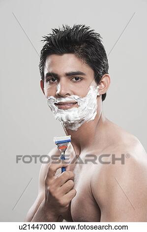 Stock Image - Man shaving. Fotosearch