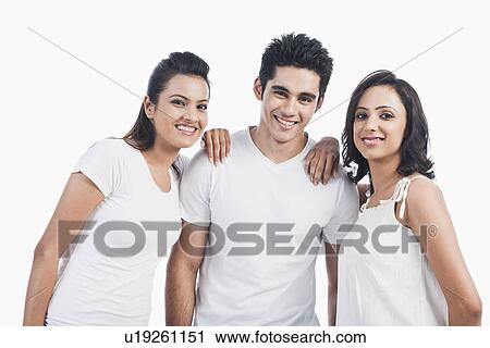 Stock Image - Man smiling with two women. Fotosearch