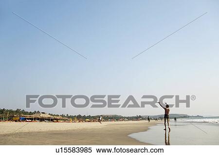 Man standing on the beach, Goa, India View Large Photo Image Stock Photography - Man standing on the beach, Goa, India. Fotosearch