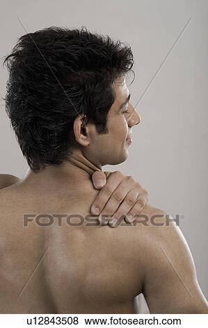 Man suffering from backache View Large Photo Image Stock Photo - Man suffering from backache. Fotosearch