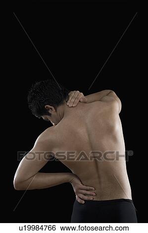 Stock Photograph - Man suffering from backache. Fotosearch