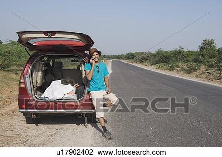 Man talking on a mobile phone View Large Photo Image Stock Image - Man talking on a mobile phone. Fotosearch