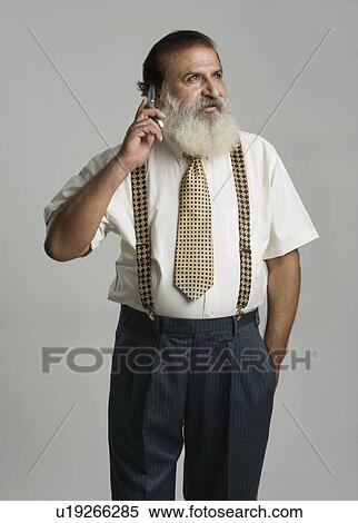Man talking on a mobile phone View Large Photo Image Stock Photography - Man talking on a mobile phone. Fotosearch