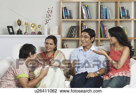 Man talking to his family View Large Photo Image Stock Image - Man talking to his family. Fotosearch