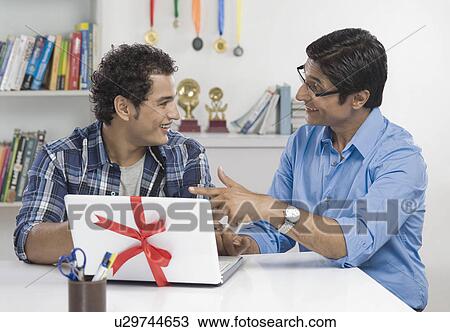 Man talking to his son View Large Photo Image Stock Image - Man talking to his son. Fotosearch