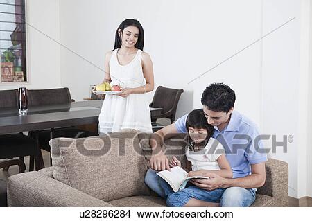 Picture - Man teaching his daughter. Fotosearch