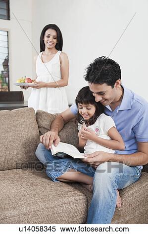 Stock Photography - Man teaching his daughter. Fotosearch