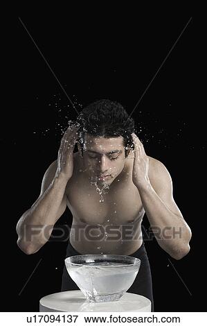 Stock Photo - Man washing face. Fotosearch