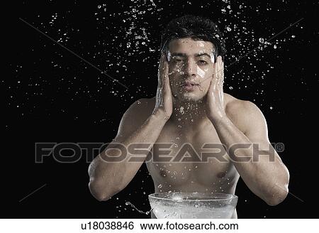 Stock Photograph - Man washing face. Fotosearch