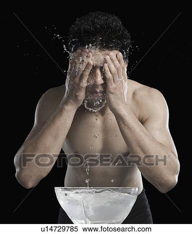 Stock Photography - Man washing face. Fotosearch