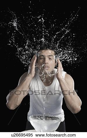 Stock Photography - Man washing face. Fotosearch
