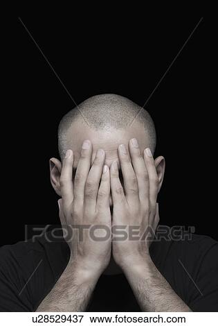 Man with his head in his hands View Large Photo Image Stock Photo - Man with his head in his hands. Fotosearch