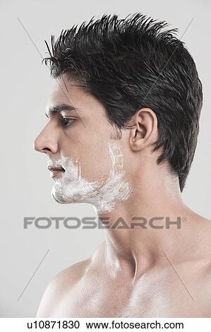 Stock Image - Man with shaving cream on his face. Fotosearch