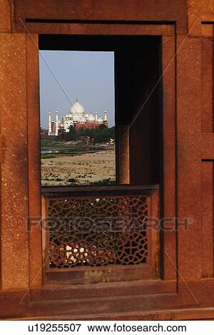 Stock Photo - Mausoleum viewed through a window of the fort, Agra Fort, Taj Mahal, Agra, Uttar Pradesh, India. Fotosearch