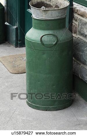 Stock Photo - Milk canister near the door of a restaurant, Killarney, County Kerry, Republic of Ireland. Fotosearch