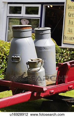 Milk canisters in front of a store, Adare, County Limerick, Republic of Ireland View Large Photo Image Stock Image - Milk canisters in front of a store, Adare, County Limerick, Republic of Ireland. Fotosearch