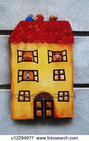 Stock Photo - Model home mounted on the wall of a building, Cesky Krumlov, South Bohemian Region, Czech Republic. Fotosearch