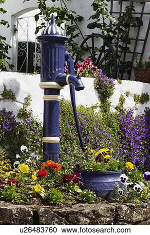 Model of hand pump between plants, Adare, County Limerick, Republic of Ireland View Large Photo Image Stock Image - Model of hand pump between plants, Adare, County Limerick, Republic of Ireland. Fotosearch