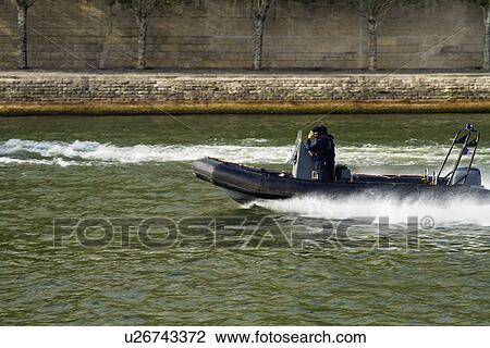 Motorboat in the river, Paris, France View Large Photo Image Stock Image - Motorboat in the river, Paris, France. Fotosearch