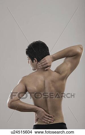 Picture - Muscular man suffering from backache. Fotosearch