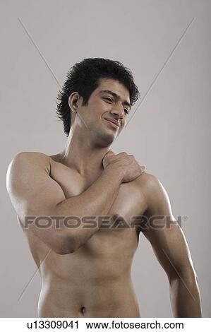 Muscular man suffering from backache View Large Photo Image Stock Image - Muscular man suffering from backache. Fotosearch