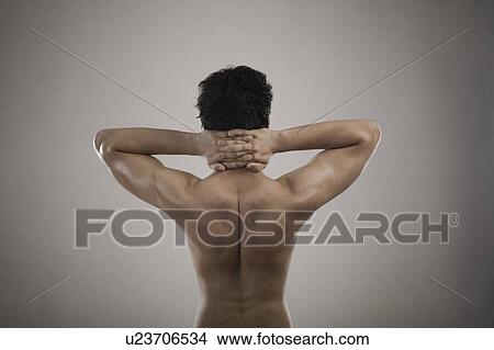 Picture - Muscular man suffering from neckache. Fotosearch