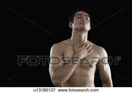 Stock Photo - Muscular man suffering from neckache. Fotosearch