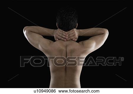 Stock Photograph - Muscular man suffering from neckache. Fotosearch