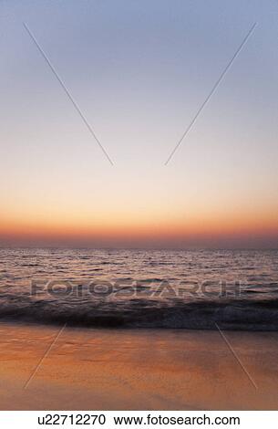 Stock Image - Panoramic view of the sea at dusk, Goa, India. Fotosearch