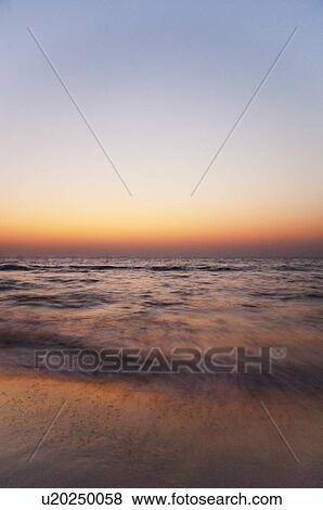 Panoramic view of the sea at dusk, Goa, India View Large Photo Image Stock Photo - Panoramic view of the sea at dusk, Goa, India. Fotosearch