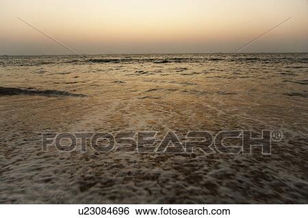 Stock Photograph - Panoramic view of the sea at dusk, Goa, India. Fotosearch
