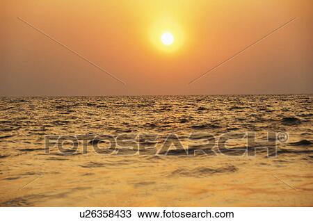 Stock Image - Panoramic view of the sea at sunset, Goa, India. Fotosearch