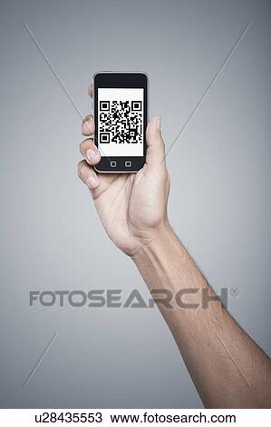Persons hand holding a mobile phone with 2D Barcode on the screen View Large Photo Image Stock Image - Persons hand holding a mobile phone with 2D Barcode on the screen. Fotosearch