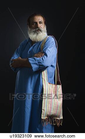 Philosopher standing with his arms crossed View Large Photo Image Stock Photo - Philosopher standing with his arms crossed. Fotosearch