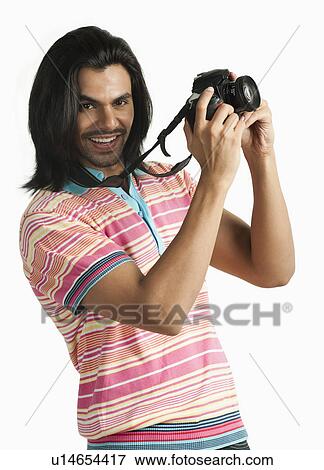 Photographer taking a picture with a digital camera View Large Photo Image Stock Photo - Photographer taking a picture with a digital camera. Fotosearch