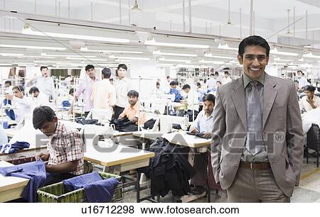 Portrait of a businessman in a textile factory View Large Photo Image Stock Photo - Portrait of a businessman in a textile factory. Fotosearch