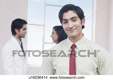 Picture - Portrait of a businessman smiling. Fotosearch