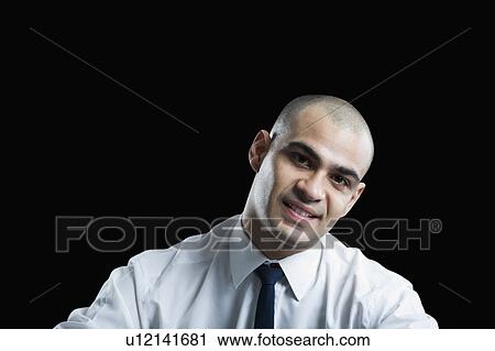Stock Image - Portrait of a businessman smiling. Fotosearch