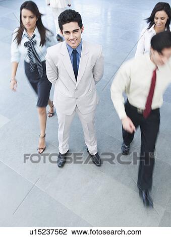 Portrait of a businessman smiling View Large Photo Image Stock Image - Portrait of a businessman smiling. Fotosearch