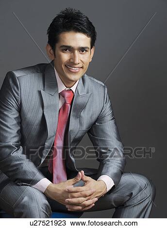 Stock Image - Portrait of a businessman smiling. Fotosearch