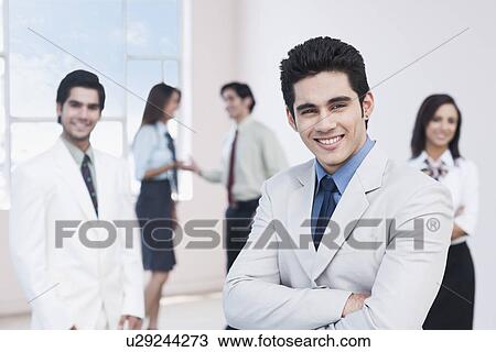 Portrait of a businessman smiling View Large Photo Image Stock Image - Portrait of a businessman smiling. Fotosearch