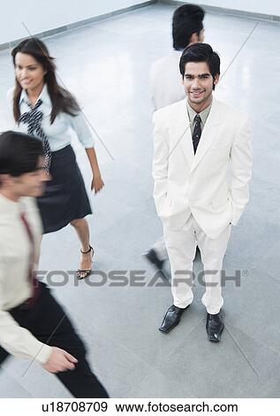 Portrait of a businessman smiling View Large Photo Image Stock Photo - Portrait of a businessman smiling. Fotosearch