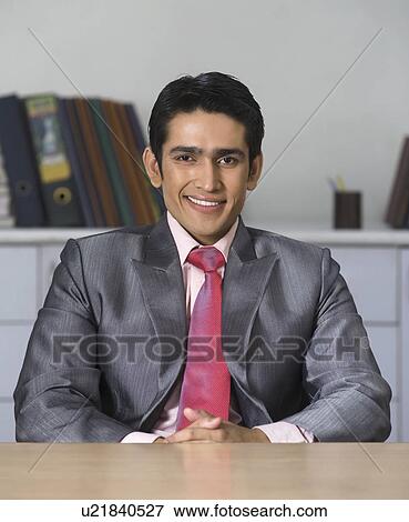 Portrait of a businessman smiling View Large Photo Image Stock Photo - Portrait of a businessman smiling. Fotosearch