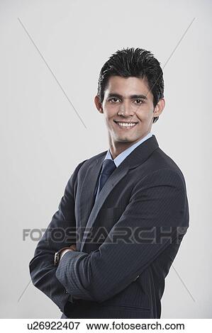 Stock Photo - Portrait of a businessman smiling. Fotosearch